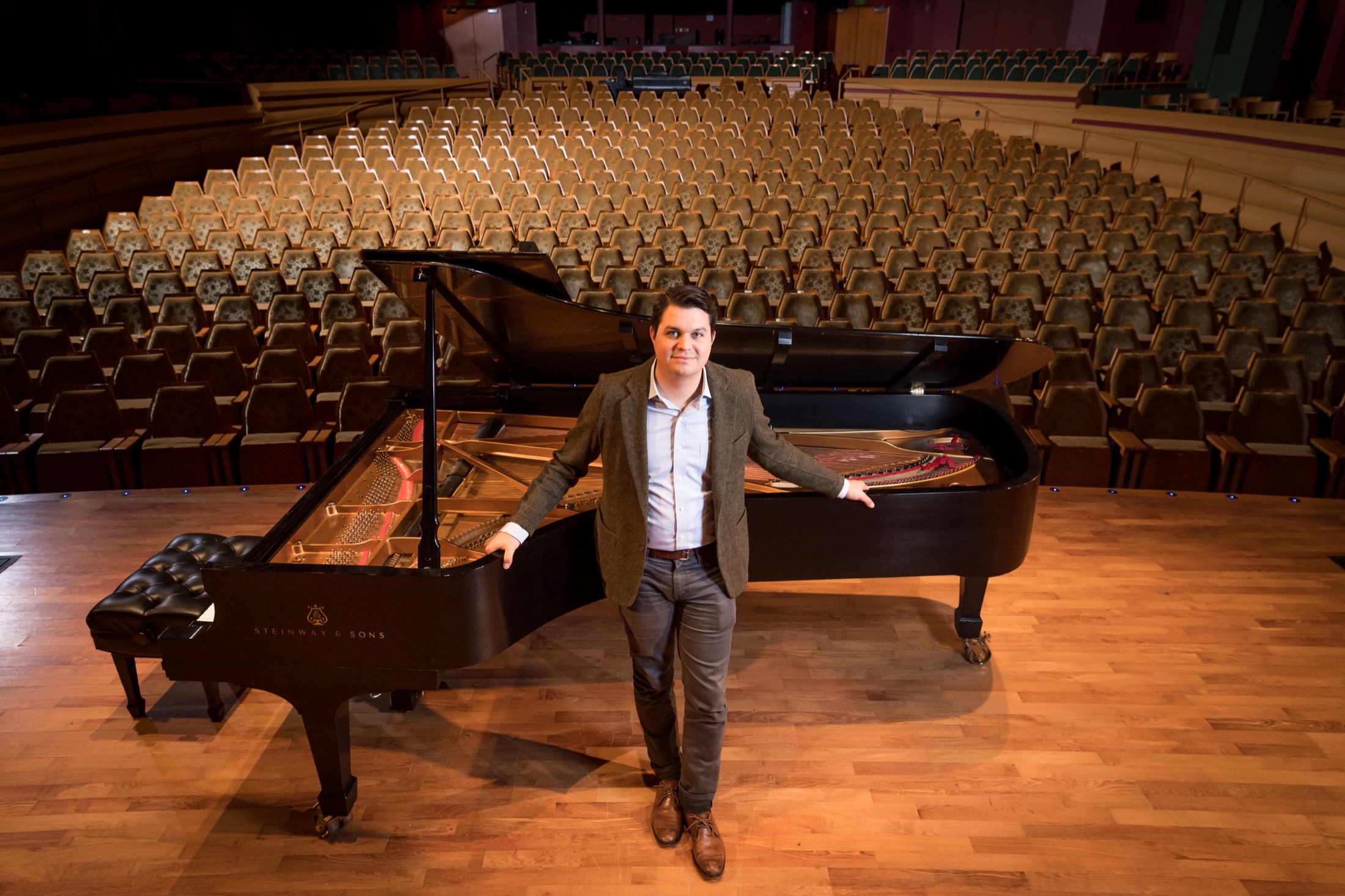 J.J. Wright seated at a piano